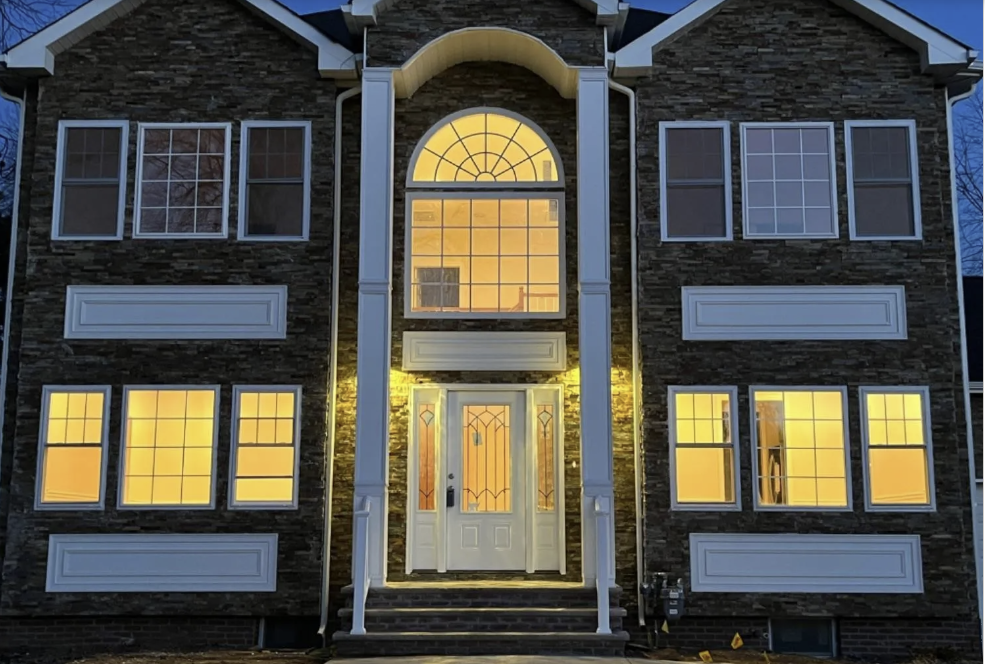 New construction home at dusk, Garden Drive
